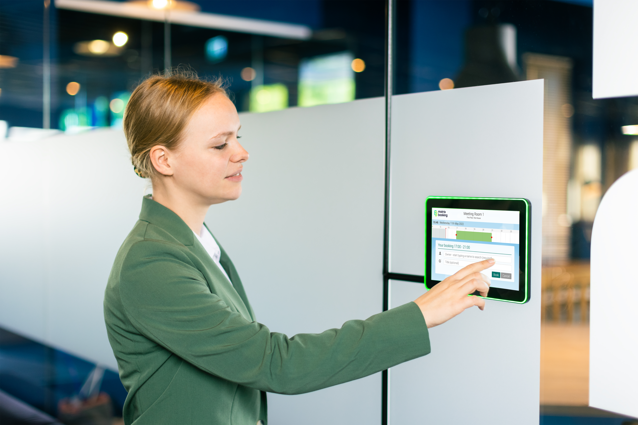 meeting room booking display system being used to book a meeting room.